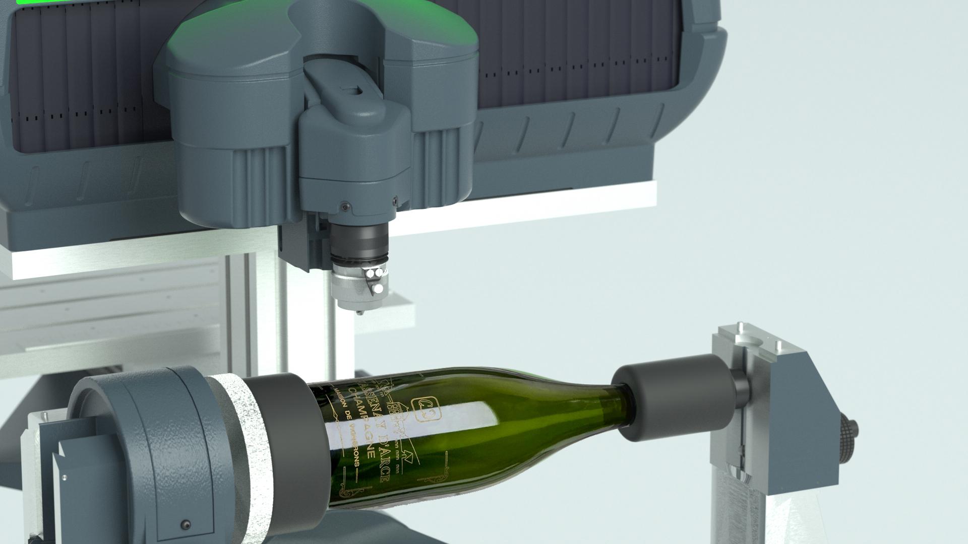 Wine bottle engraving shown on a rotary engraver installed in a rotary device