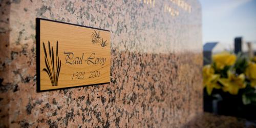 Wooden commemorative plaque created with a funeral engraving machine