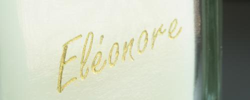 Close up of a glass engraving filled with gold gilding wax