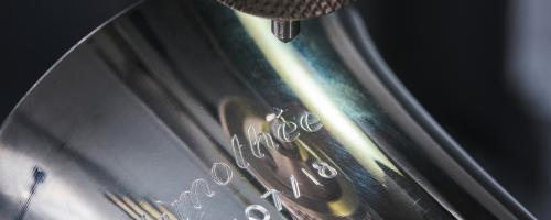 Stainless steel engraving of the name "Timothée" and a date on a christening goblet