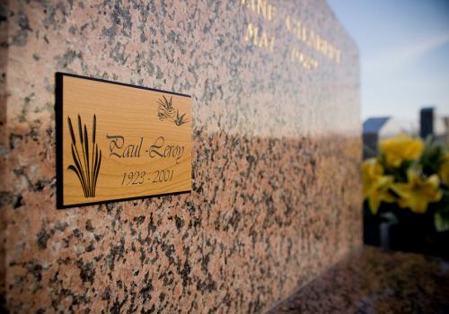 Wooden commemorative plaque created with a funeral engraving machine