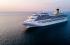 Leisure and cruise ship on sea, with setting sun
