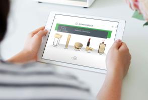 A tablet showing cosmetic engraving options for perfume and makeup items with Gravotouch software
